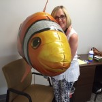 Marketing manager, Cathy F. cuddles with Chester