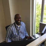 Vanir I., data analyst has a park view from his desk